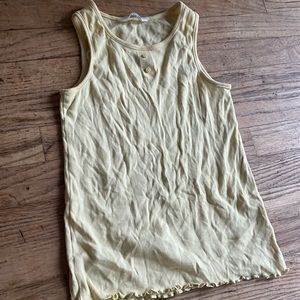 pastel yellow tank top, with buttons. ruffles at the bottom from H&M